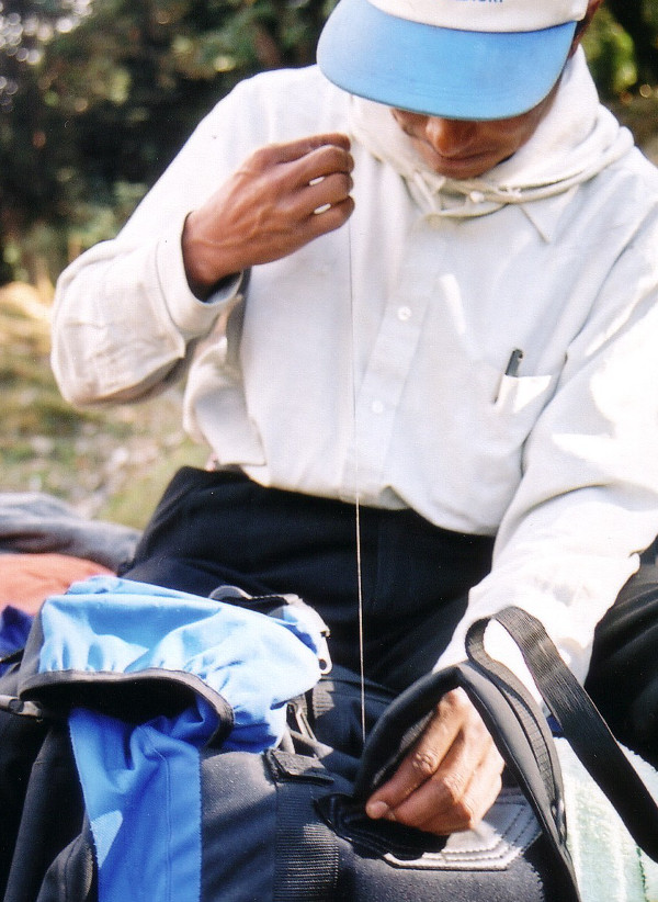 Repairing bag strap on the trek